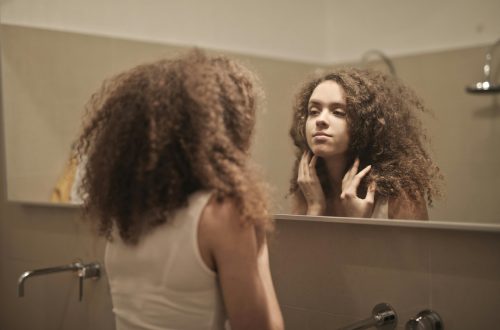 woman looking in a mirror