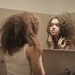 woman looking in a mirror