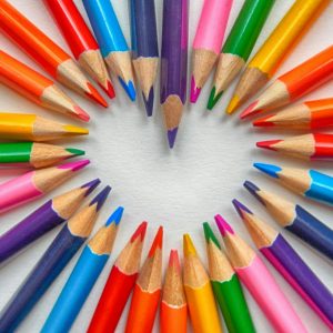 set of coloring pencils forming heart